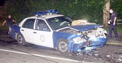 Police officer smashes his police cruiser at high speed.